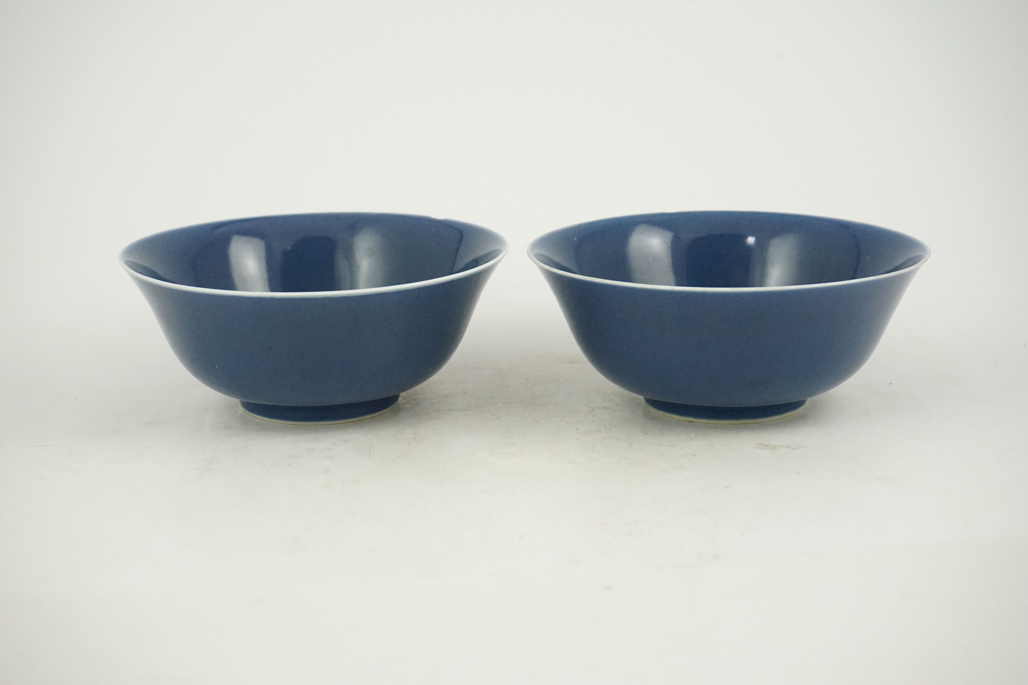 A pair of Chinese powder blue glazed bowls, Daoguang mark and of the period (1821-50)